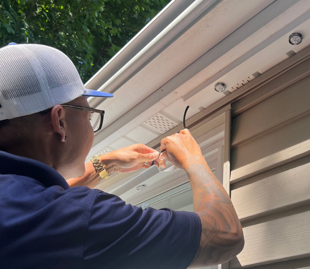 Mesh cap gold watch wiring installation under roof eaves with tattoo NEI Distributors North Reading MA.